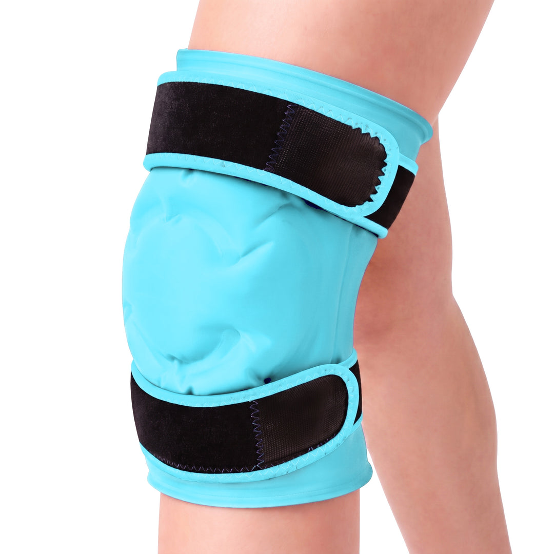 Light blue knee ice pack gel sleeve worn on a knee against a white background, the same view, the padded front panel and both black straps in view