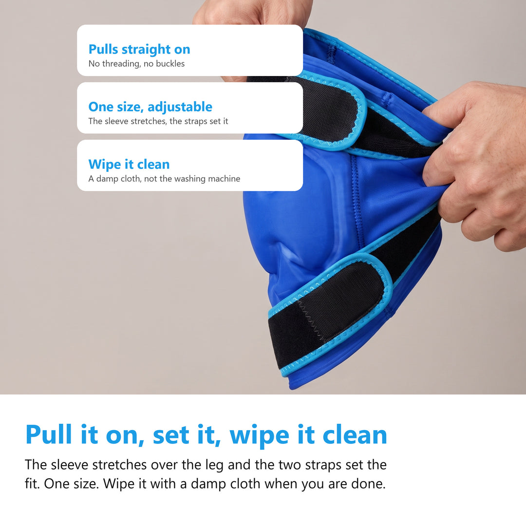 Two hands stretching the blue knee ice pack gel sleeve open by its hem against a plain grey background