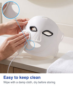 Wiping the white LED face mask with a soft cloth