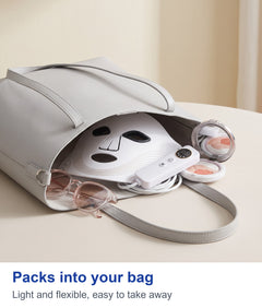 White LED face mask and controller packed in a tote bag