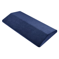 Navy blue triangle wedge lumbar support pillow with a dotted velvet cover, shown on a plain white background