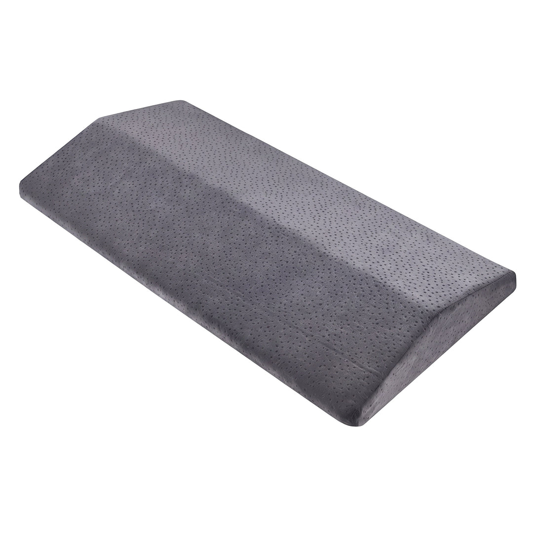 Grey triangle wedge lumbar support pillow with a dotted velvet cover, shown on a plain white background