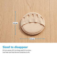 Nude metatarsal pad flat on a pale oak floor with measurement arrows reading 9.5cm across and 8.5cm long