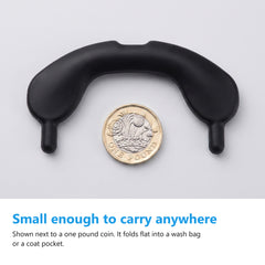 Nasal dilator band shown next to a one pound coin for scale