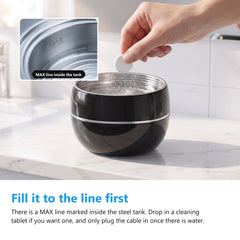 Filling the ultrasonic retainer cleaner to the MAX line and dropping in a cleaning tablet