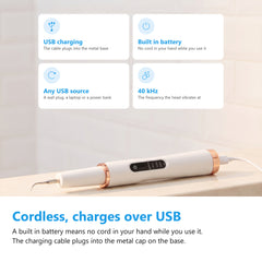 Ultrasonic tooth cleaner charging over USB, the cable plugged into the metal base on the handle