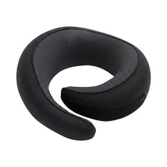 Memory foam travel neck pillow in black, coiled, with black mesh lining