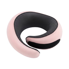 Memory foam travel neck pillow in blush pink, coiled, with black mesh lining