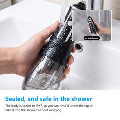 IPX7 cordless water flosser being rinsed clean under a running tap