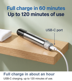Nose hair trimmer charging by USB-C on a bathroom shelf