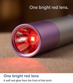 Macro of the glowing red lens on the torch