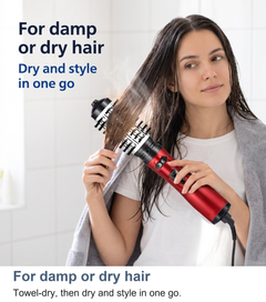 Rotating hot air brush used on damp or dry hair