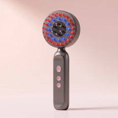 Electric scalp massager in black with the red and blue LED ring lit