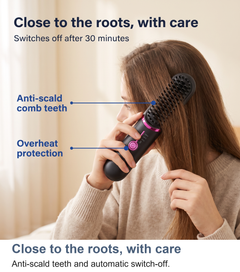 Woman using the heated straightening brush close to the roots with anti-scald comb teeth