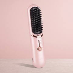 Pink cordless heated straightening brush